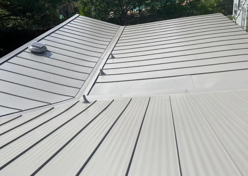 Solar attic fan installed on a metal roof for Roof Ventilation in New Berlin